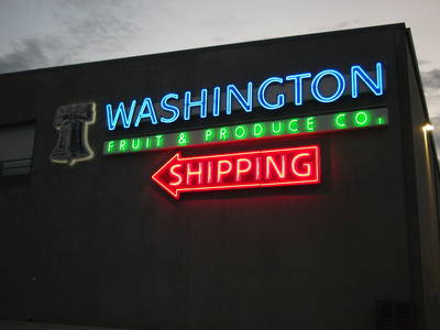 Neon fruit company sign